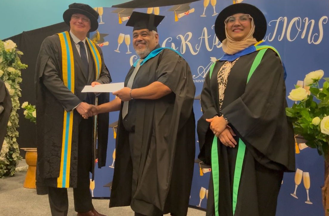 Amro Elrouby receiving an award at graduation