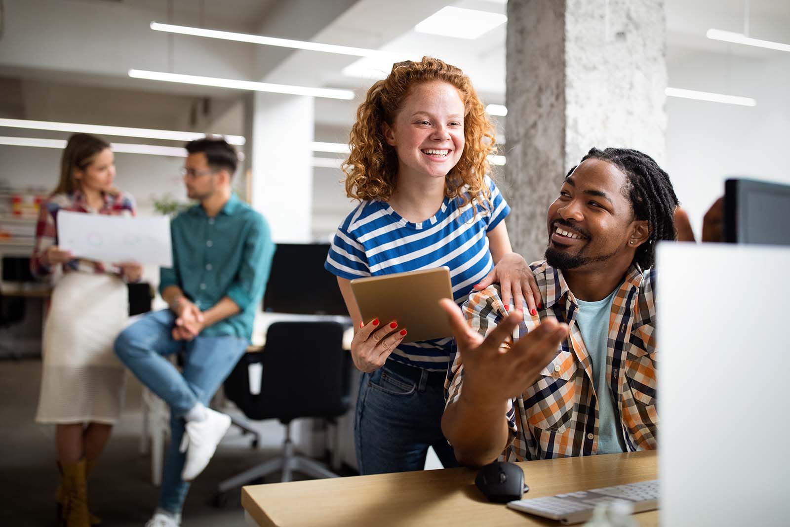 Colleagues looking relaxed and happy in the workplace