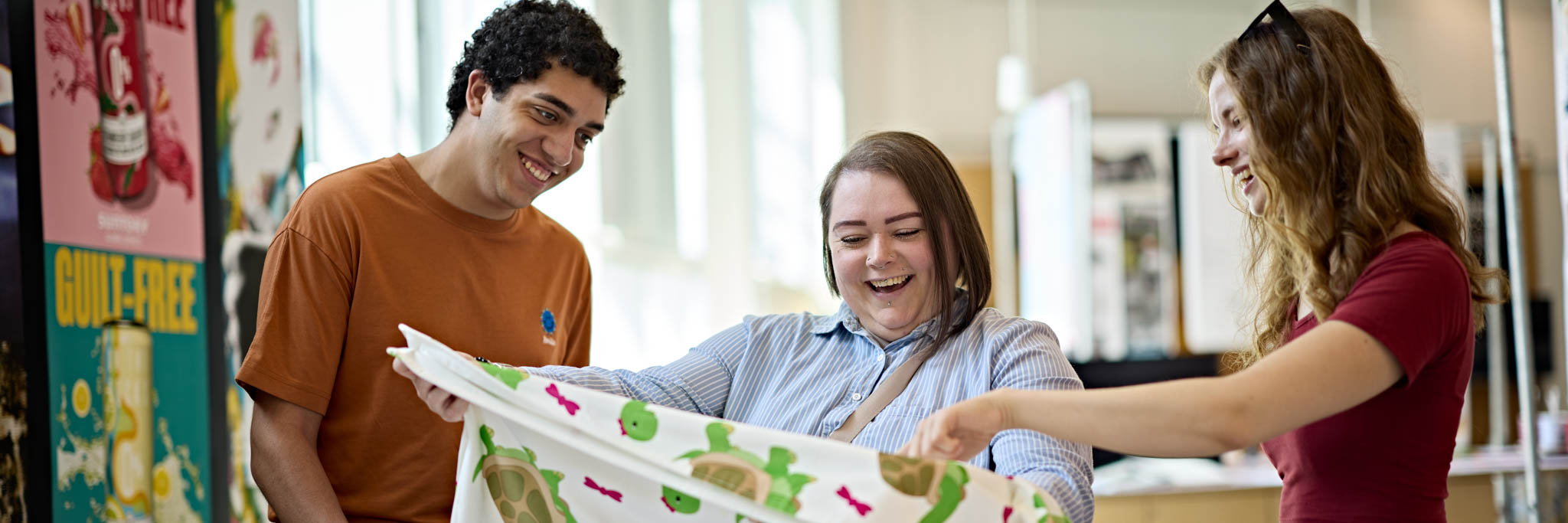 Students holding cloth