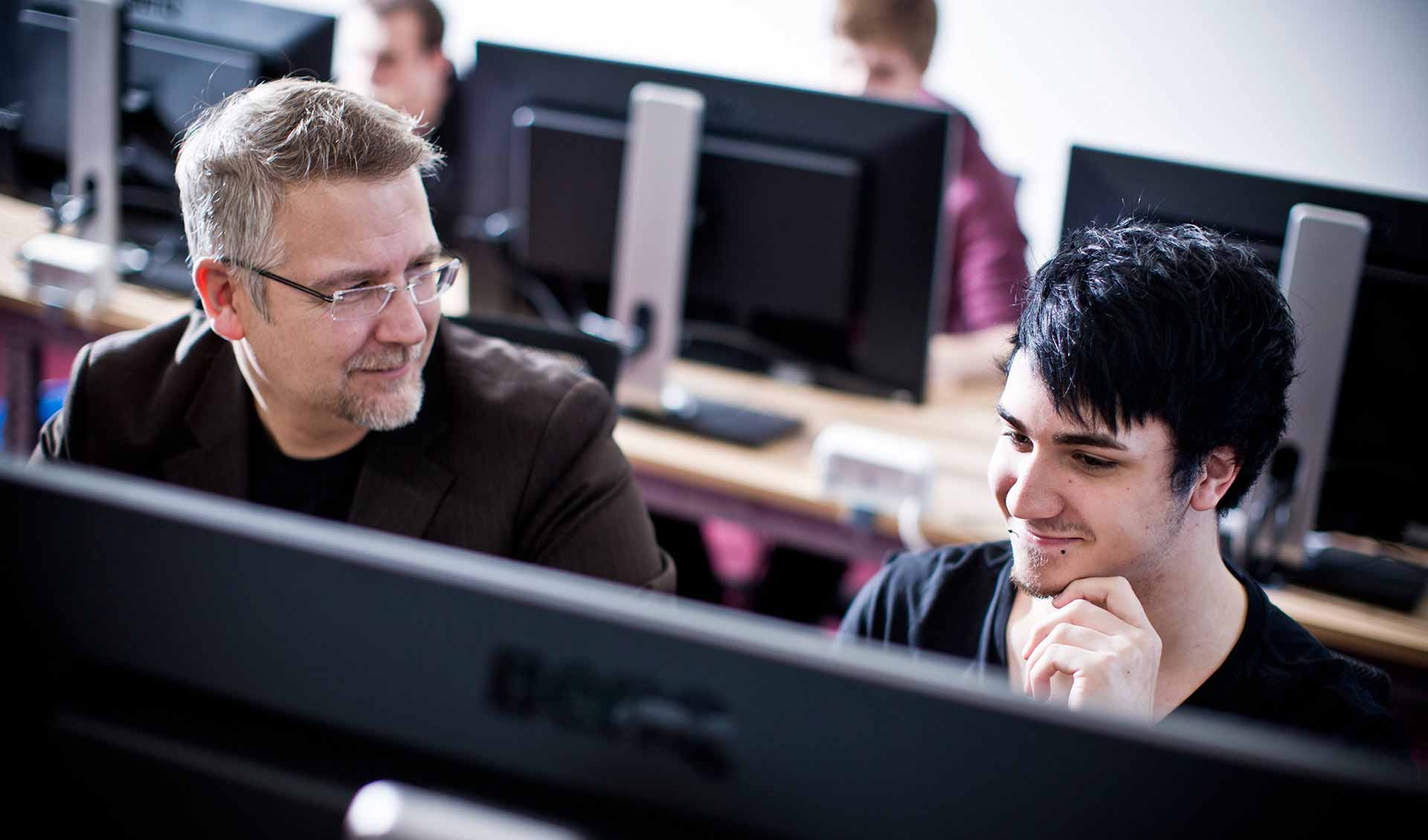 Teacher and student in a games lab