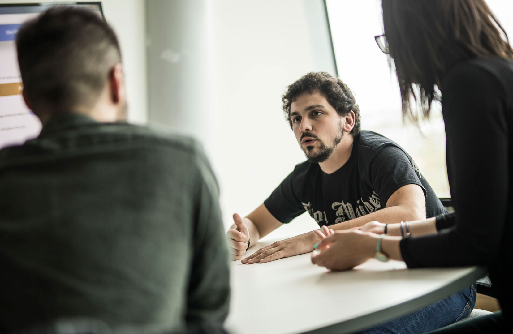 Postgraduate research students in discussion